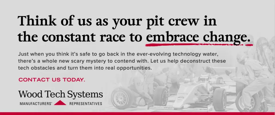 Print ad: ‘Think of us as your pit crew in the constant race to embrace change,’ over a faded race-car pit stop photo